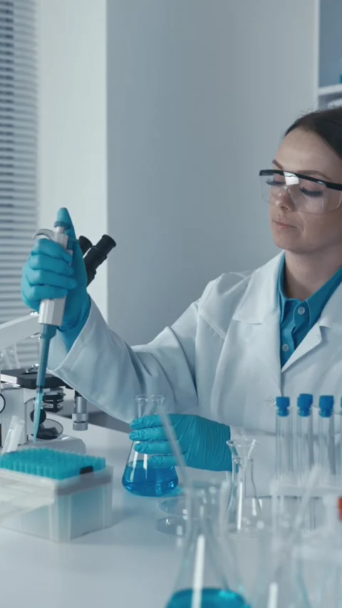 In the laboratory, the pharmacist-technologist develops new forms of drug Video stock 266560926