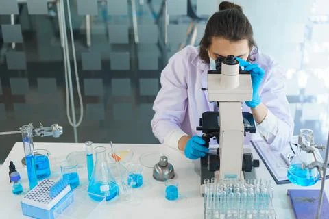 Laboratory research concept, Scientist using microscope to research and devel Stock Photos