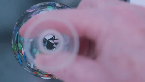 Laboratory research on microplastic pollution in a glass flask, symbolizing wate Stock Footage 331322326
