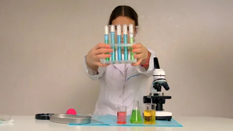 Laboratory research test tubes reagents and microscope. Selective focus. Stock Footage 313331597