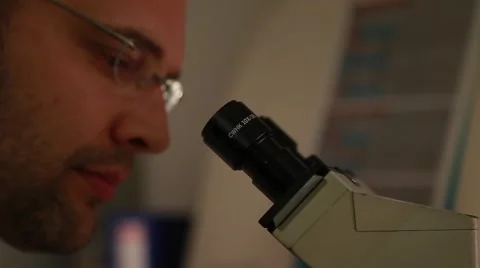 Laboratory researcher working with microscope 2 Video stock 41532770