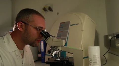 Laboratory researcher working with microscope 3 Stock Footage 41532749