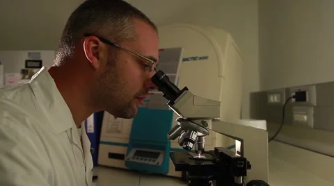 Laboratory researcher working with microscope 5 Stock Footage 41531238