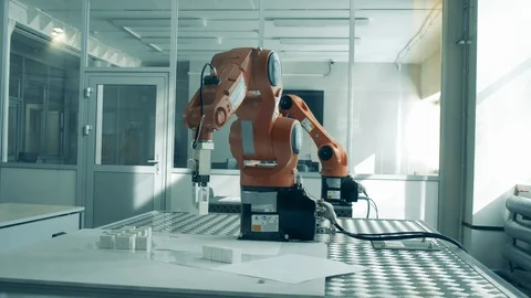 Laboratory with robotic devices doing easy tasks Stock Footage 127627208