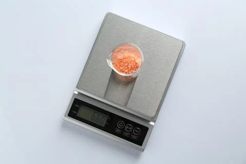 Laboratory scale with beaker of sample on white background, top view Foto stock