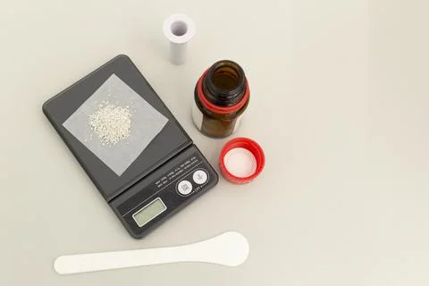 The laboratory scale of black color on table with material on surface and ope Stock Photos