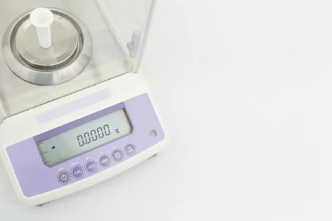 Laboratory scale on table in white background Stock Photos