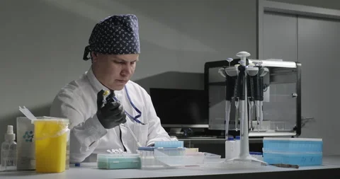Laboratory scientific research or experiment. Scientist or chemist drops liquid Stock Footage 272500979