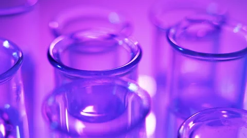 In the laboratory, the scientist analyzes the colored fluid in the test tube. Stock Footage 122441901