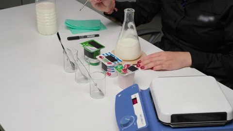 Laboratory scientist analyzing milk samples Stock Footage 306326947