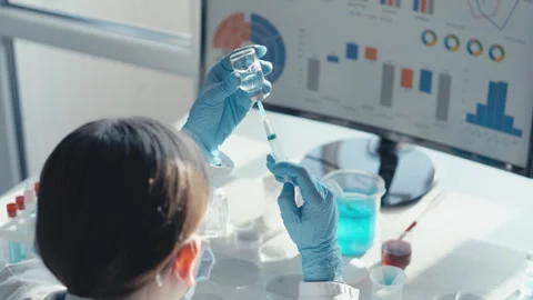 In the laboratory, a scientist demonstrates precision in biochemistry and Stock Footage 277932013