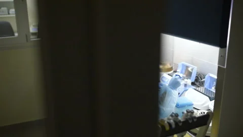 A laboratory scientist with a dispenser in his hands conducts experience or Stock Footage 99956177