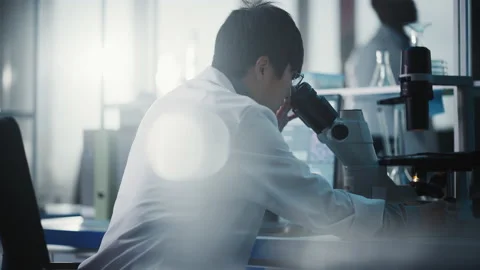 In Laboratory Scientist Using Microscope Video stock 148863812