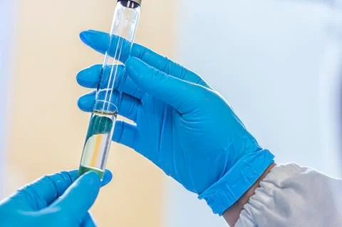 Laboratory scientist working at lab with test tube Stock Photos