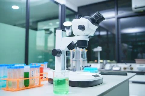 Laboratory Setup with Microscope and Test Tubes for Research and Analysis Stock Photos