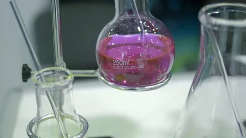 On the laboratory table are several flasks with colored solutions Stock Footage 340623325