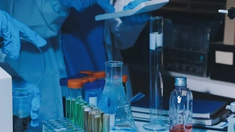 A laboratory technician makes microscopic bacteriological examination with .. Stock Footage 336485585