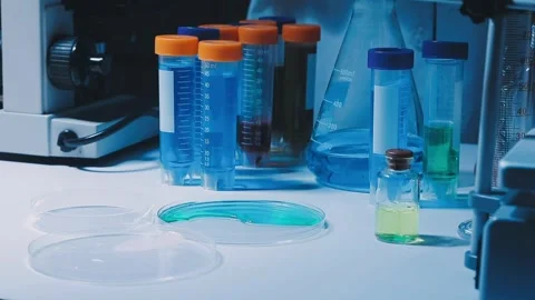 A laboratory technician makes microscopic bacteriological examination with .. Stock Footage 336485624