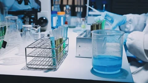 A laboratory technician makes microscopic bacteriological examination with .. Stock Footage 336485657