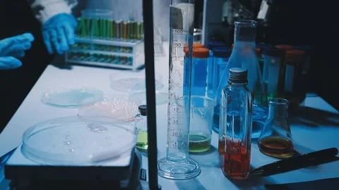 A laboratory technician makes microscopic bacteriological examination with .. Stock Footage 336485664