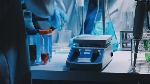 A laboratory technician makes microscopic bacteriological examination with .. Stock Footage 336485676