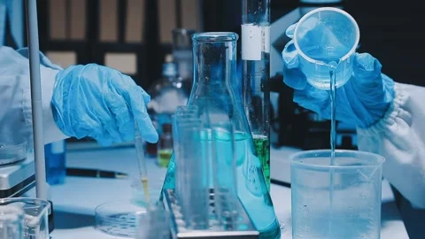 A laboratory technician makes microscopic bacteriological examination with .. Stock Footage 336485685