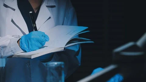 A laboratory technician makes microscopic bacteriological examination with .. Stock Footage 336485728