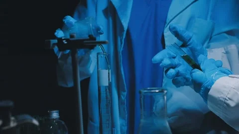 A laboratory technician makes microscopic bacteriological examination with .. Stock Footage 336485759