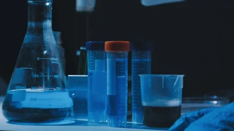 A laboratory technician makes microscopic bacteriological examination with .. Stock Footage 336485772
