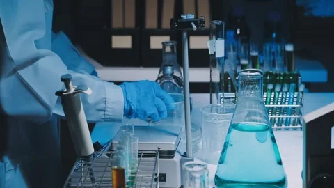 A laboratory technician makes microscopic bacteriological examination with .. Stock Footage 336485784
