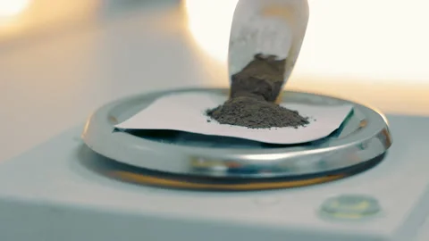 A laboratory technician measures the weight of a sample of the finished product Stock Footage 234115291