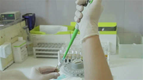 Laboratory technician performing blood analysis in hospital lab, hands close up. Video stock 50029397