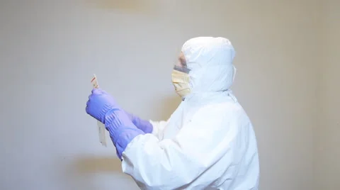 Laboratory technician placing specimen sample into bio-hazard bag. Stock Footage 60095880