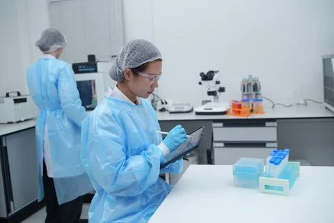 Laboratory Technician Using Tablet for Chemical Research and Data Collection Stock Photos