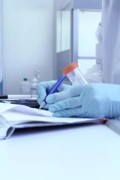 Laboratory technician write test results from lab Stock Photos