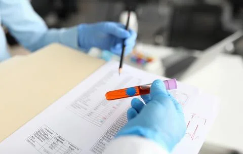 Laboratory technicians conducting tests in a modern lab setting with colorful Foto stock