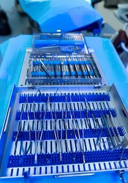 Laboratory test tubes and vials on blue tray in medical setting Stock Photos
