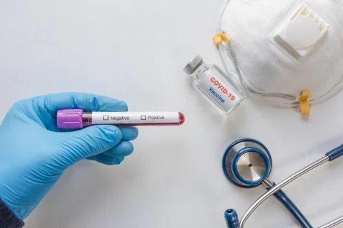 Laboratory testing patients blood samples for presence of coronavirus (COVID- Stock Photos