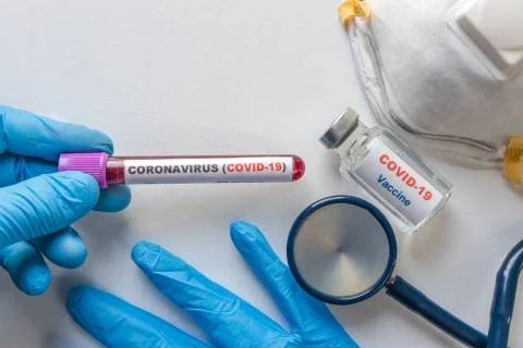 Laboratory testing patients blood samples for presence of coronavirus (COVID- Stock Photos