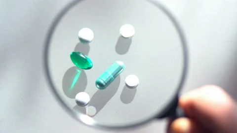 Laboratory tests. Pills lying on the table. Close-up on medicines Stock Footage 86364797