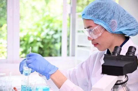 Laboratory woman lab microscope testing doctor technology analysis health c.. Stock Photos