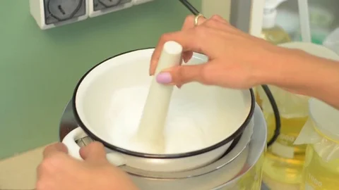 Laboratory worker checking the contents of glassware Stock Footage