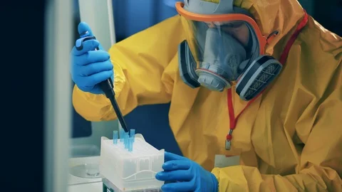 Laboratory worker develops a vaccine for coronavirus. Stock Footage 129520768