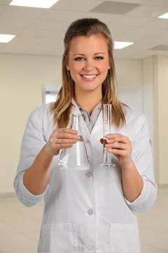 Laboratory Worker Holding Glassware Stock Photos