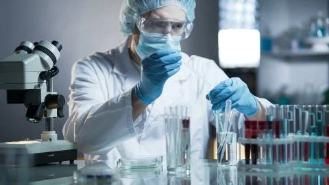 Laboratory worker measuring exact formula for hypoallergenic cosmetic products Stock Photos