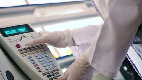 Laboratory worker programs the device. Stock Footage 70991169