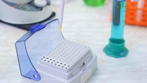 Laboratory worker puts samples into a tray making analysis for immunity viruses Stock Footage 124859806