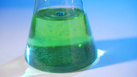 Laboratory worker scientist laboratory assistant tests chemicals for reactions Video stock 110409180