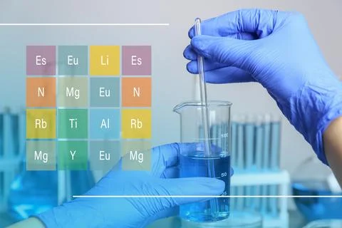 Laboratory worker stirring liquid with glass rod indoors and chemical eleme.. Stock Photos