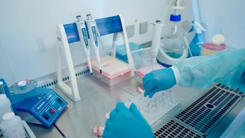 Laboratory worker with test tubes. Modern laboratory indoors. Stock Footage 120564743